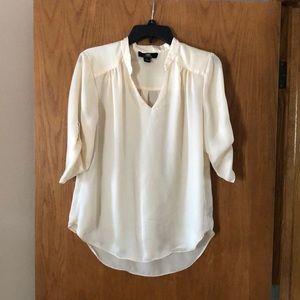 Cream colored blouse with 3/4 sleeves